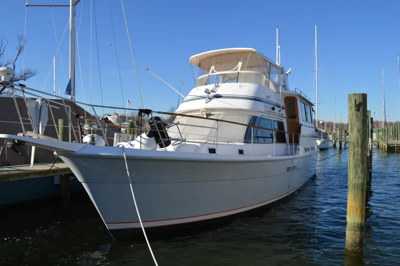 The Image of 1986 Gulfstar 49 Motor Yacht docked in a marina. - 0