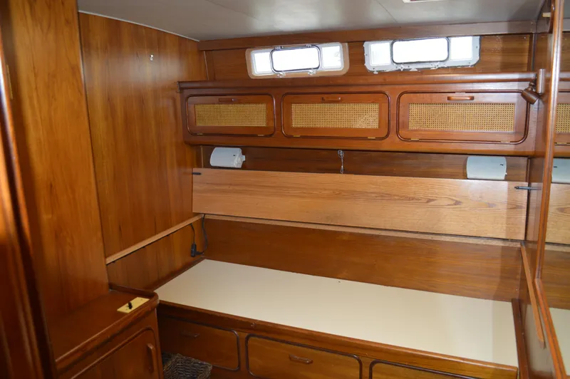Slide: The Image of Interior cabin of a 1986 Gulfstar 49 Motor Yacht with wooden furnishings. - 21