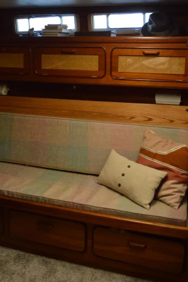 Slide: The Image of Interior of 1986 Gulfstar 49 Motor Yacht with wooden cabinets and cushioned seating. - 22