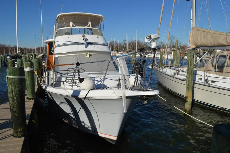 Slide: The Image of 1986 Gulfstar 49 Motor Yacht docked at a marina. - 3