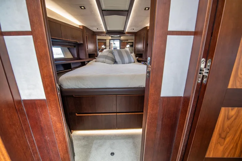 Slide: The Image of Luxurious bedroom interior of 2020 Galeon 560 Sky yacht with wooden finishes. - 29
