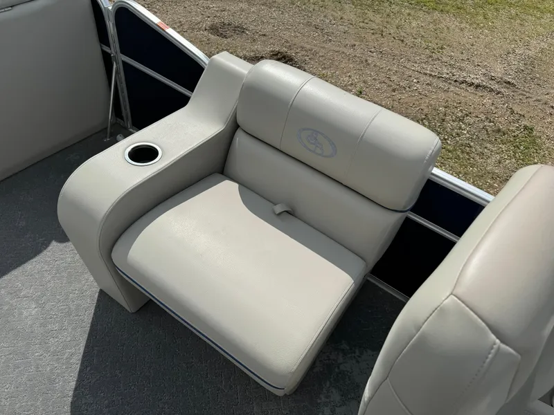 Slide: The Image of 2014 South Bay 520FC boat seat with cup holder. - 10