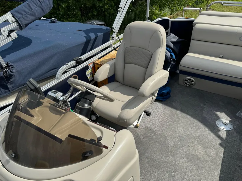 Slide: The Image of 2014 South Bay 520FC boat interior with captain's chair and dashboard. - 14