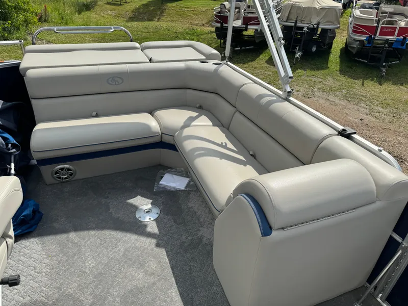 Slide: The Image of 2014 South Bay 520FC pontoon boat interior with beige seating. - 15