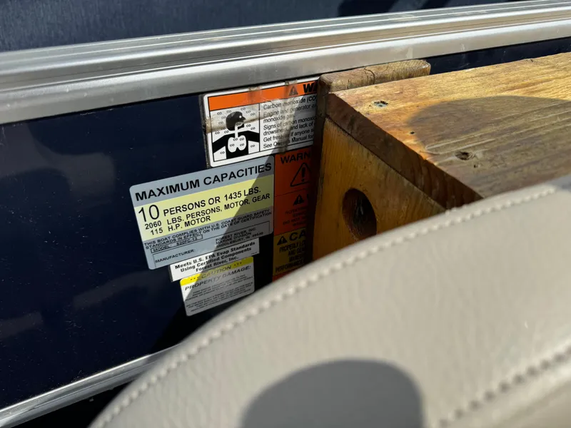 Slide: The Image of 2014 South Bay 520FC boat capacity label, maximum 10 persons or 1435 lbs. - 17