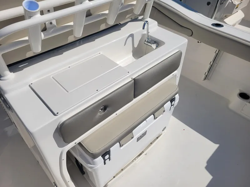 Slide: The Image of 2024 Key West 263 FS boat with covered seats and dual outboard motors. - 17