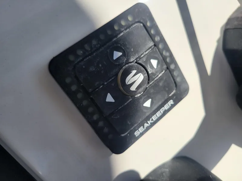 Slide: The Image of 2024 Key West 263 FS boat with dual Yamaha 200 engines, docked in a marina. - 5