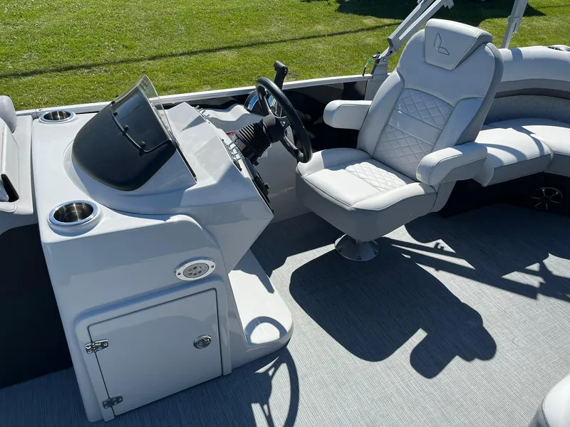 Slide: The Image of 2024 Lowe SS 210 WT boat interior with captain's chair and control console. - 10