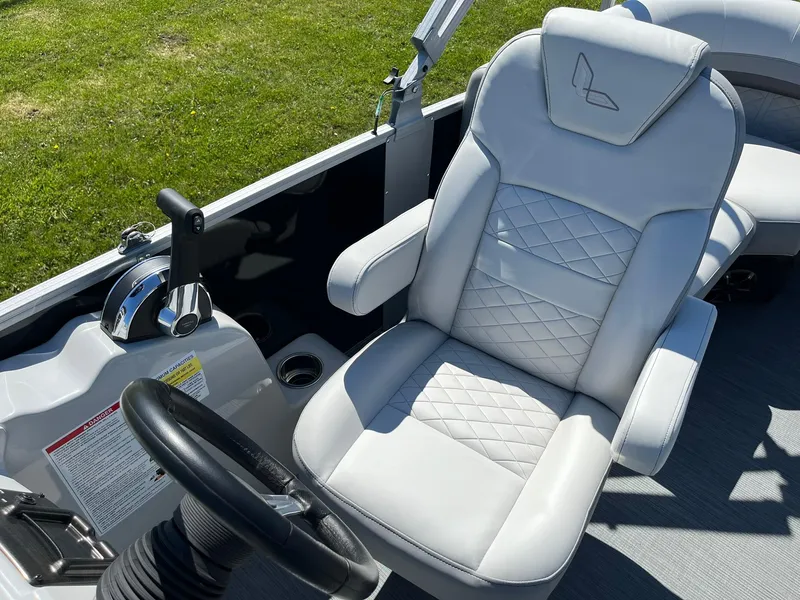 Slide: The Image of 2024 Lowe SS 210 WT boat captain's chair and control console. - 11