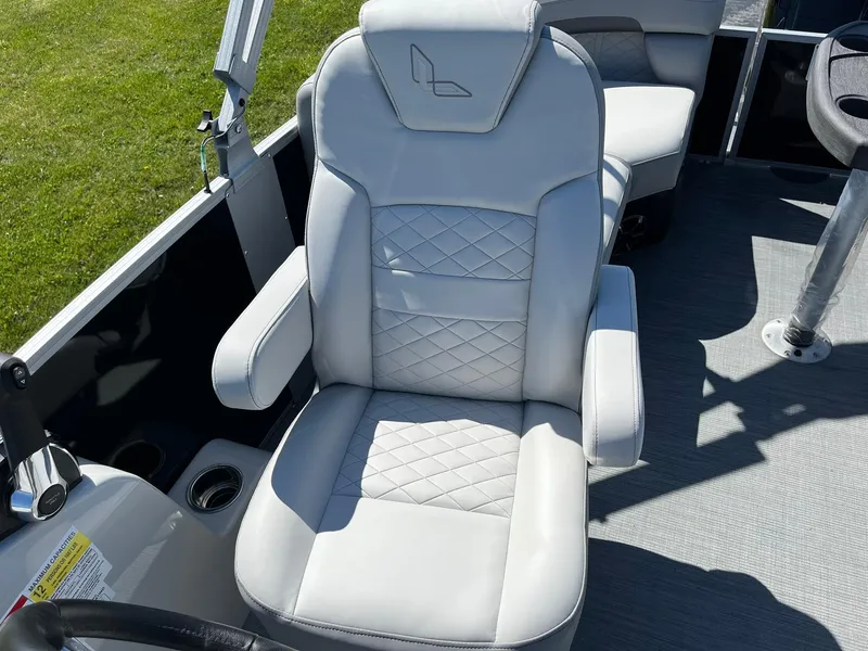 Slide: The Image of 2024 Lowe SS 210 WT boat captain's chair with armrests and diamond-stitched upholstery. - 12