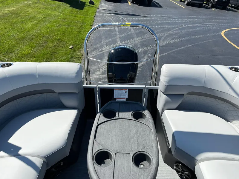 Slide: The Image of 2024 Lowe SS 210 WT pontoon boat interior with seating and table. - 15