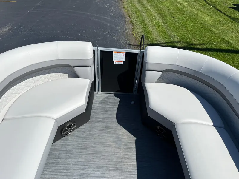 Slide: The Image of 2024 Lowe SS 210 WT pontoon boat with spacious seating and modern design. - 18