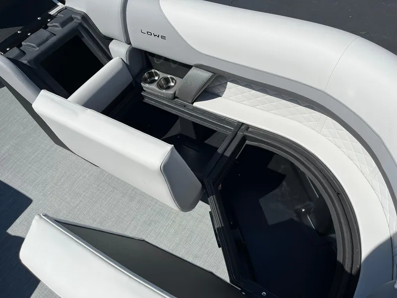 Slide: The Image of 2024 Lowe SS 210 WT boat interior with seating and storage compartments. - 21