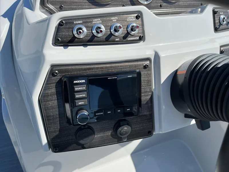 Slide: The Image of 2024 Lowe SS 210 WT boat dashboard with stereo and control panel. - 22