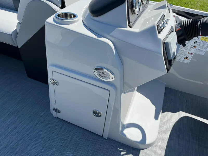 Slide: The Image of 2024 Lowe SS 210 WT boat console with storage compartment and cup holder. - 25