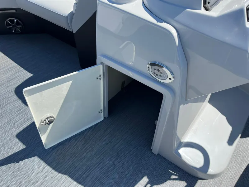 Slide: The Image of Open storage compartment on 2024 Lowe SS 210 WT boat. - 26