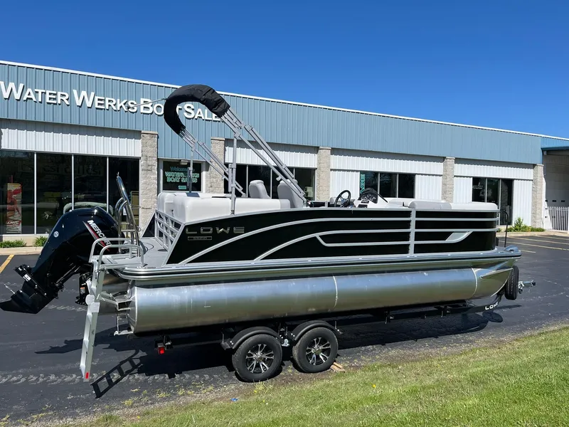 Slide: The Image of 2024 Lowe SS 210 WT pontoon boat on trailer outside Water Werks Boat Sales. - 28