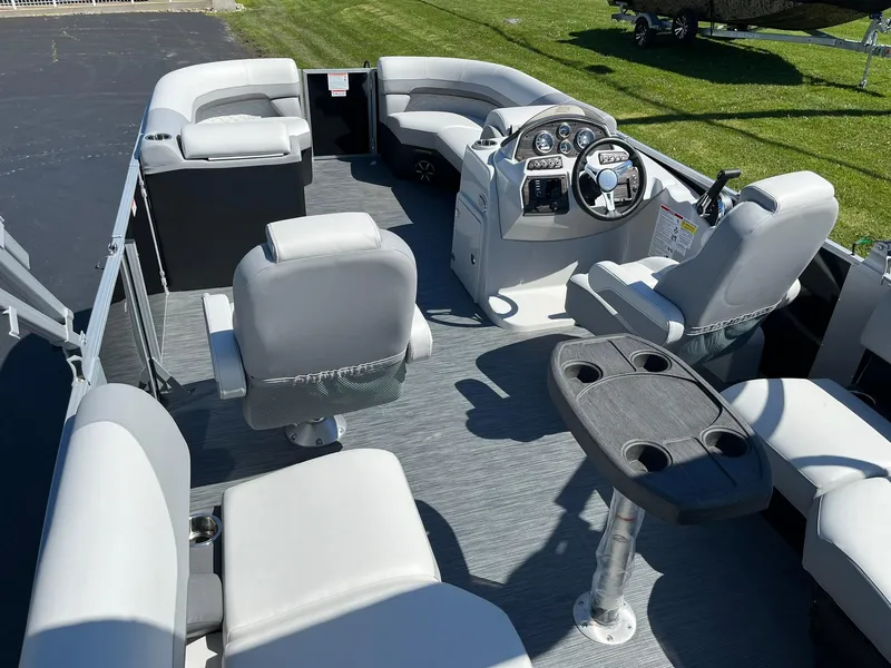 Slide: The Image of 2024 Lowe SS 210 WT pontoon boat interior with seating and steering console. - 6