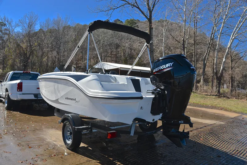 Slide: The Image of 2023 Bayliner Element M17 boat with Mercury outboard motor on trailer. - 12
