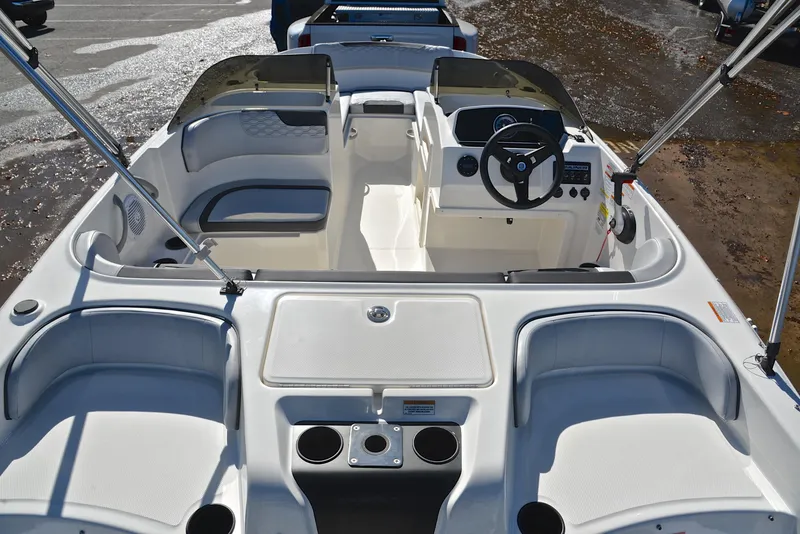 Slide: The Image of 2023 Bayliner Element M17 boat interior with seating and steering console. - 18