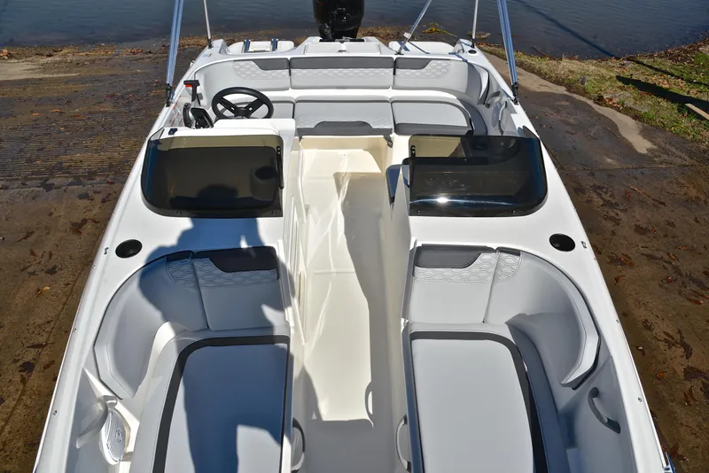 Slide: The Image of 2023 Bayliner Element M17 boat interior with seating and steering wheel. - 20