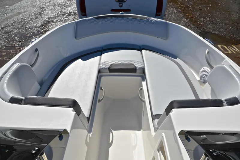 Slide: The Image of 2023 Bayliner Element M17 boat interior with cushioned seating and storage compartments. - 21