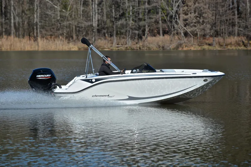 Slide: The Image of 2023 Bayliner Element M17 boat cruising on a calm lake. - 3