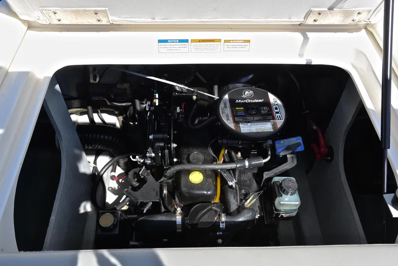 Slide: The Image of 2013 Bayliner 185 boat engine compartment with MerCruiser engine. - 26