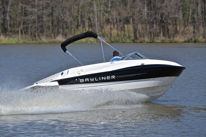 Slide: The Image of 2013 Bayliner 185 speedboat cruising on a lake. - 5