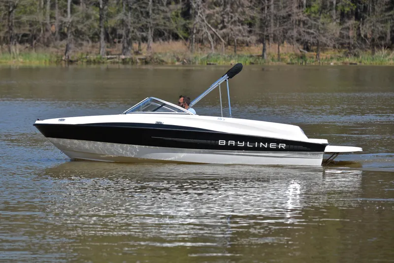 Slide: The Image of 2013 Bayliner 185 boat cruising on a calm lake. - 9