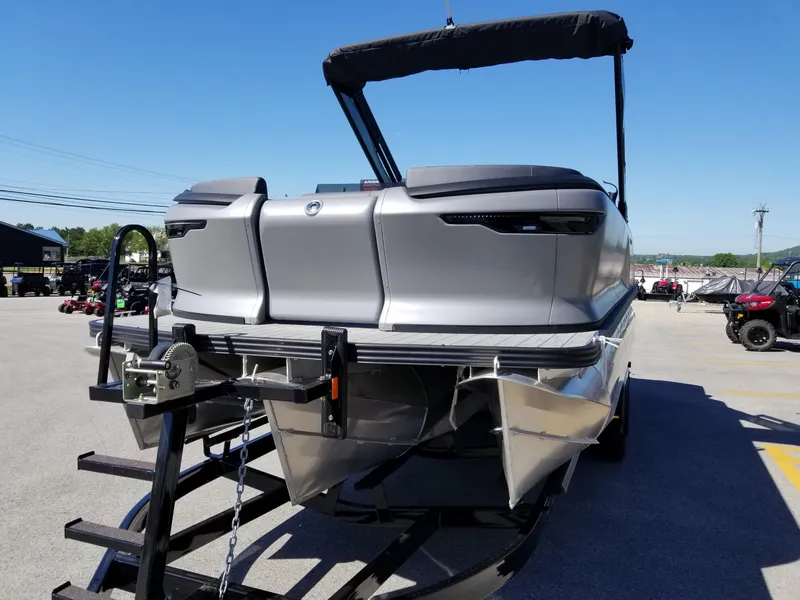 Slide: The Image of 2024 Manitou Explorer 22 Max Bench pontoon boat on trailer. - 4