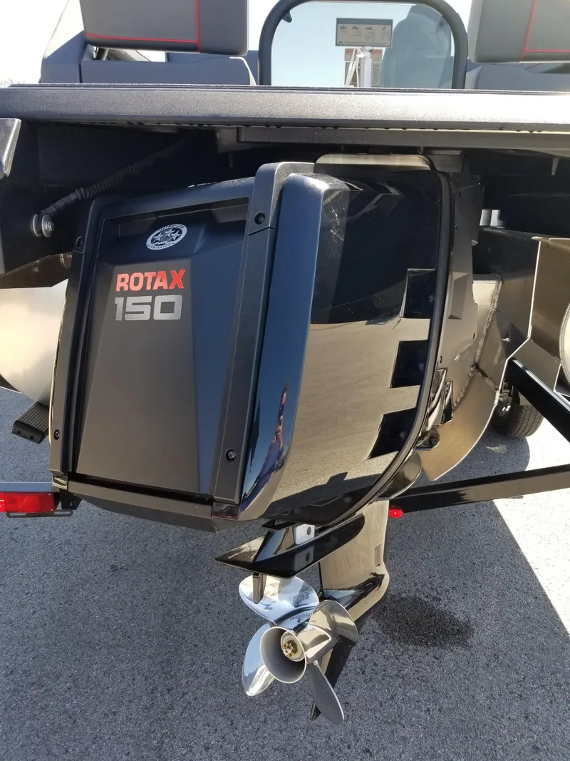 Slide: The Image of 2024 Manitou Explorer 22 Max Bench with Rotax 150 engine, rear view. - 7