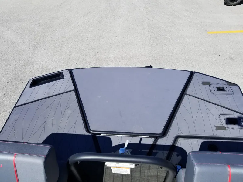 Slide: The Image of 2024 Manitou Explorer 22 Max Bench boat deck with seating and storage compartments. - 9