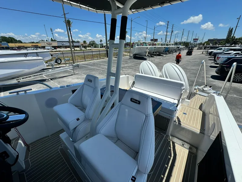 Slide: The Image of 2024 Windy SR28 CC boat interior with white seats and modern design. - 26