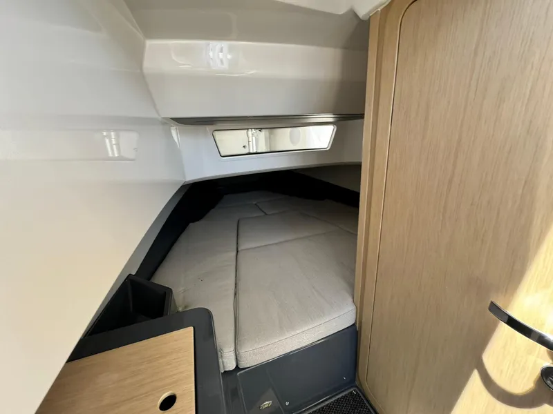Slide: The Image of Interior cabin of 2024 Windy SR28 CC boat with cozy sleeping area. - 28