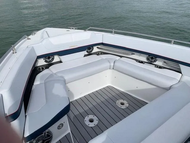 Slide: The Image of 2021 Formula 380 Super Sport Crossover OB boat interior with white seating. - 17