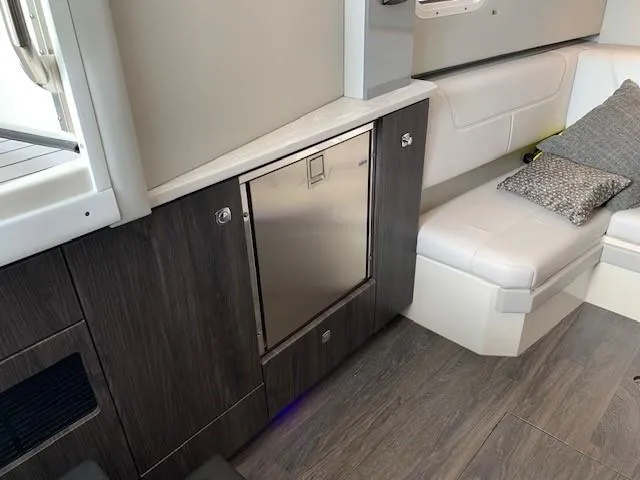 Slide: The Image of Interior of 2021 Formula 380 Super Sport Crossover OB with modern seating and cabinetry. - 19