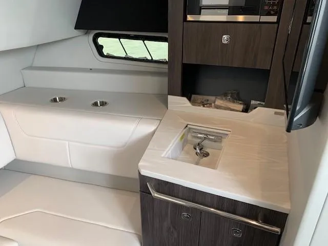 Slide: The Image of Interior of 2021 Formula 380 Super Sport Crossover OB with sink and seating area. - 20