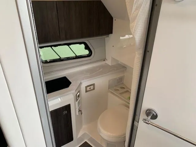Slide: The Image of 2021 Formula 380 Super Sport Crossover OB bathroom with modern fixtures and compact design. - 22