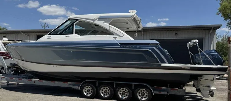 Slide: The Image of 2021 Formula 380 Super Sport Crossover OB boat on a trailer, side view. - 24