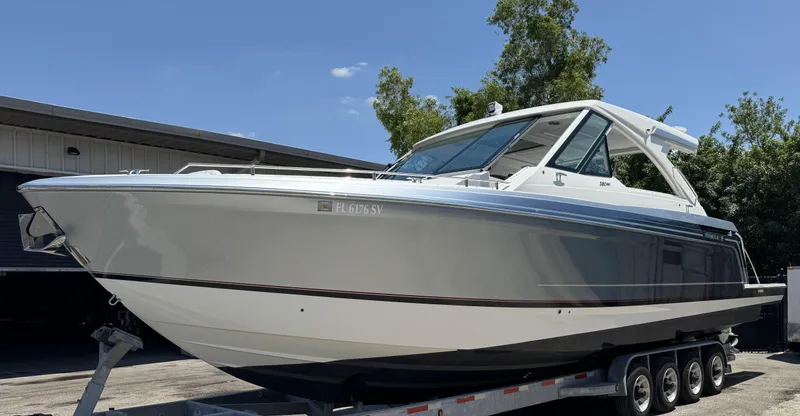 Slide: The Image of 2021 Formula 380 Super Sport Crossover OB boat on a trailer. - 25