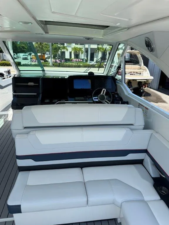 Slide: The Image of 2021 Formula 380 Super Sport Crossover OB interior with helm and seating area. - 27