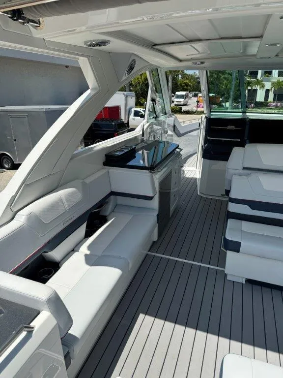 Slide: The Image of 2021 Formula 380 Super Sport Crossover OB interior with luxurious seating and modern amenities. - 28