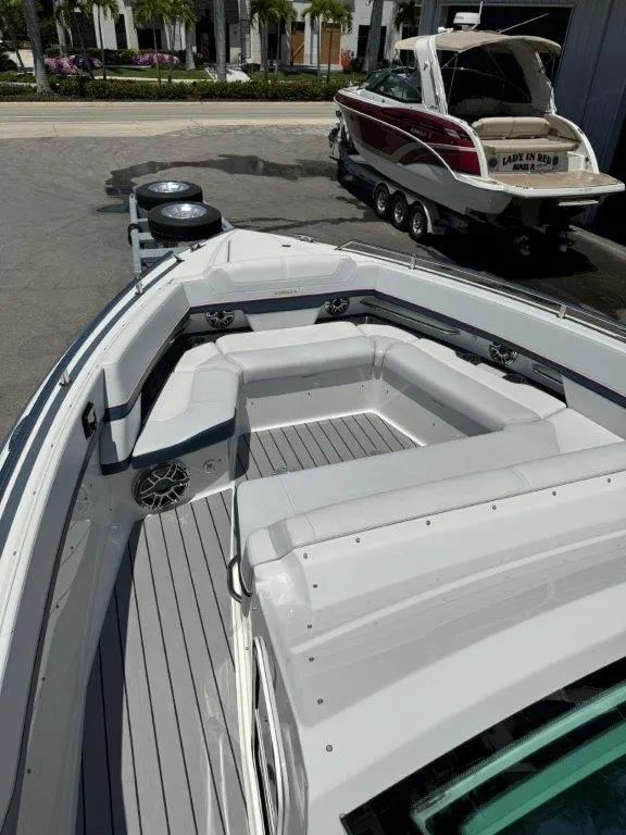 Slide: The Image of 2021 Formula 380 Super Sport Crossover OB boat with spacious seating and modern design. - 29