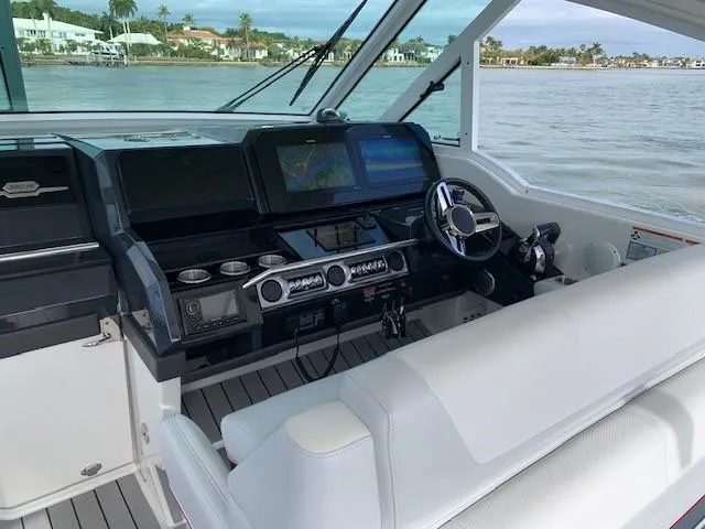 Slide: The Image of Cockpit of a 2021 Formula 380 Super Sport Crossover OB with advanced navigation systems. - 3