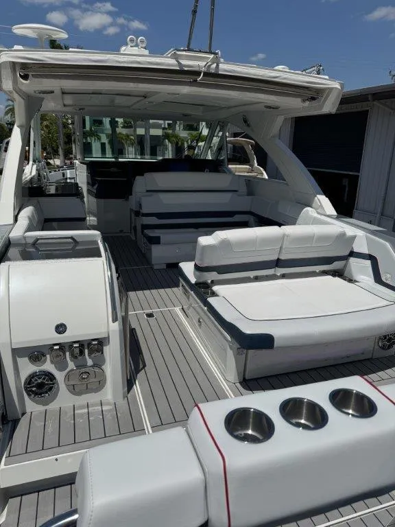 Slide: The Image of 2021 Formula 380 Super Sport Crossover OB boat interior with spacious seating and modern amenities. - 32