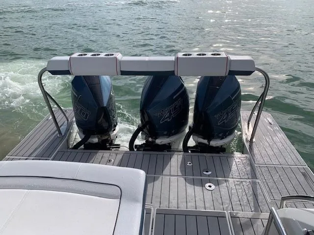 Slide: The Image of 2021 Formula 380 Super Sport Crossover OB with triple outboard engines on water. - 9