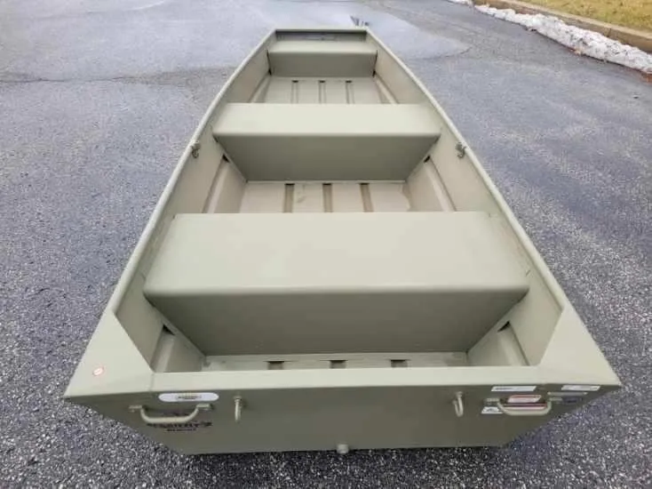 Slide: The Image of 2024 Tracker Grizzly 1236 Jon boat on pavement. - 2