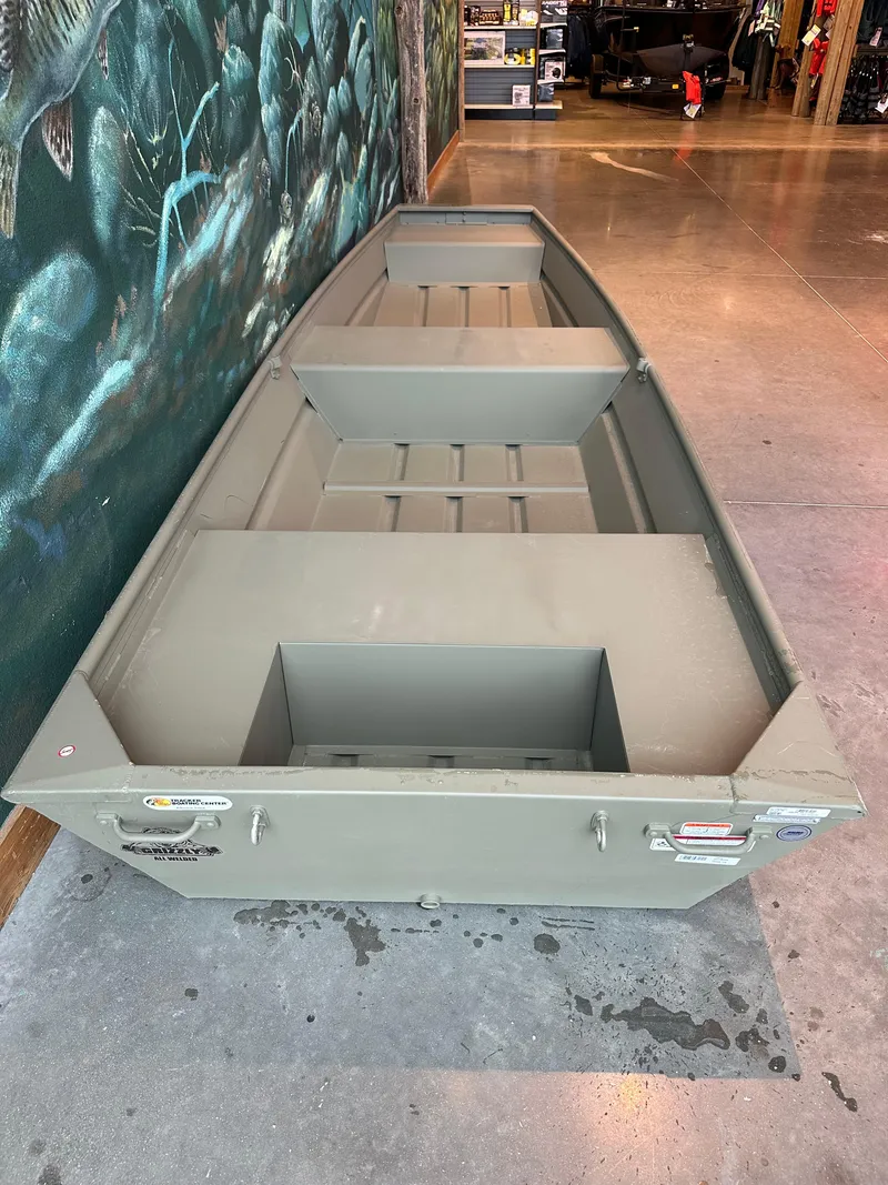 Slide: The Image of 2024 Tracker Grizzly 1436 Jon boat on display indoors. - 2