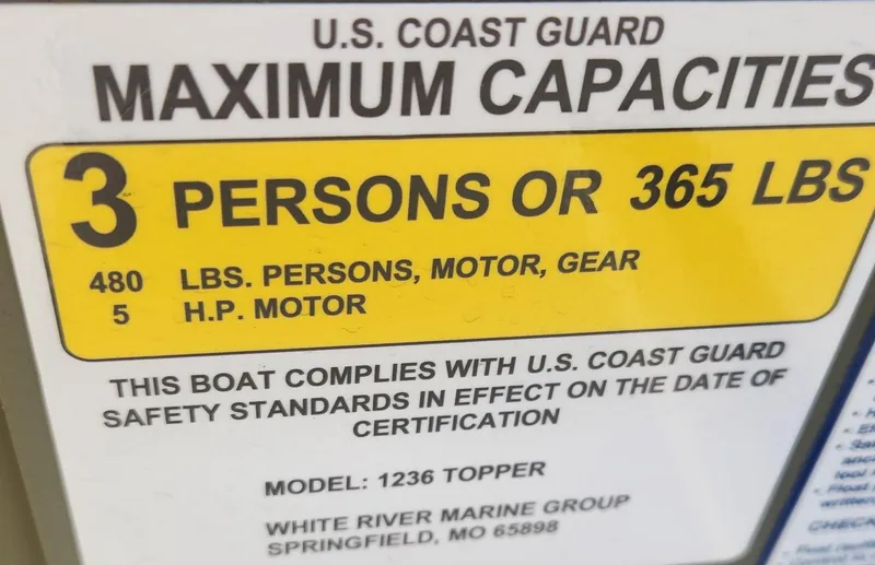 Slide: The Image of 2024 Tracker Grizzly 1236 Jon boat capacity label, U.S. Coast Guard compliant, 3 persons or 365 lbs. - 4